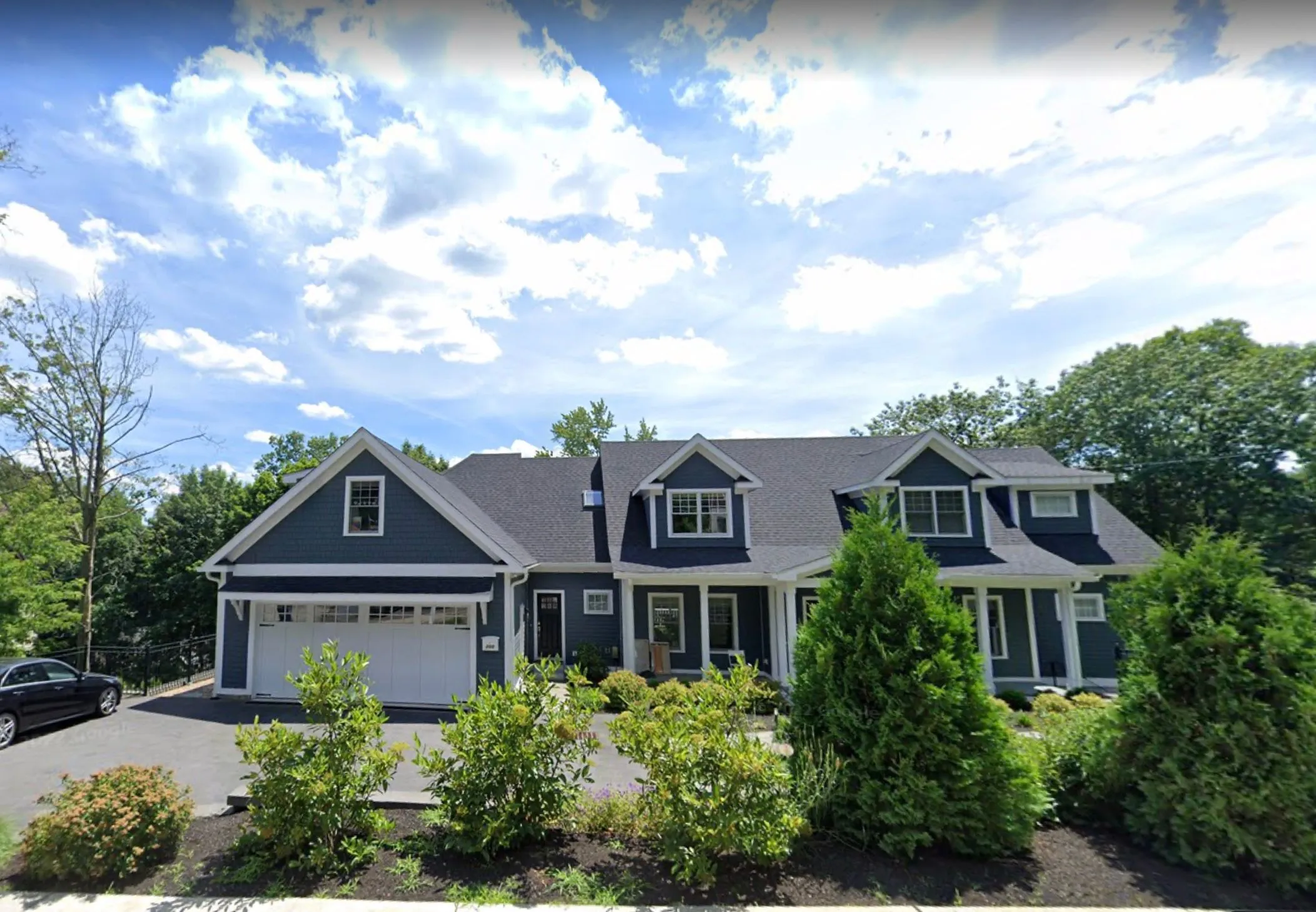 Kenrick St single family home exterior in Newton, MA, managed by Omega Permits